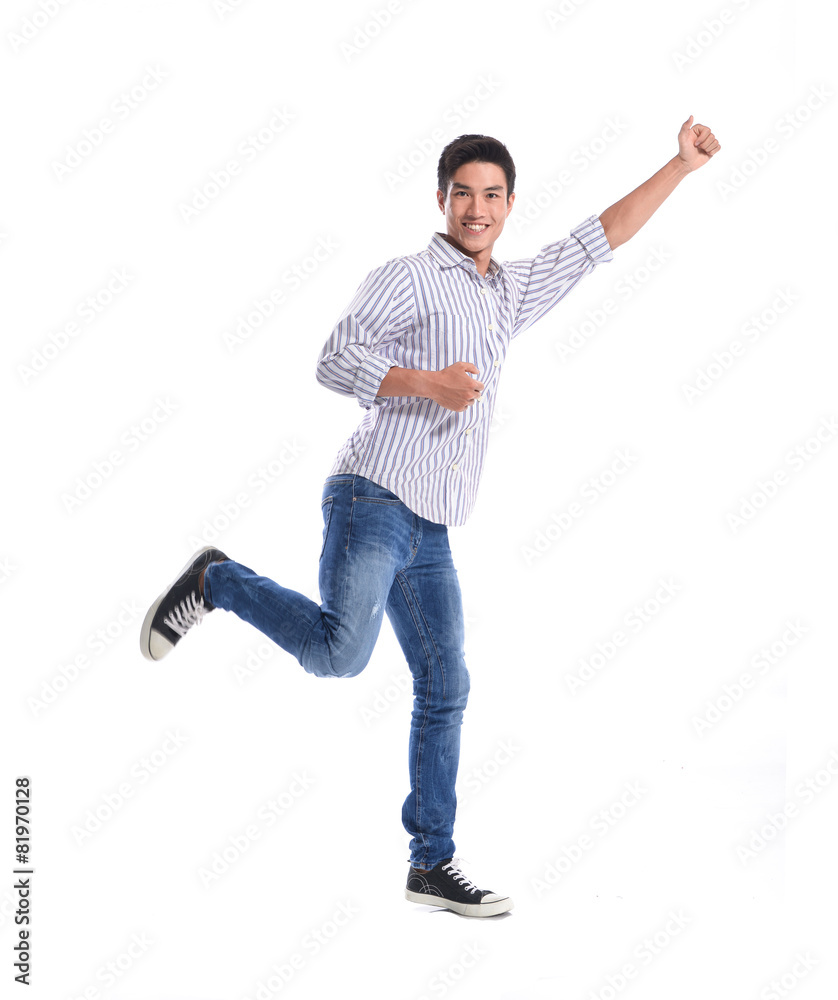 Full length Portrait of happy casual man walking in studio Full length Portrait of happy casual man walking in studio