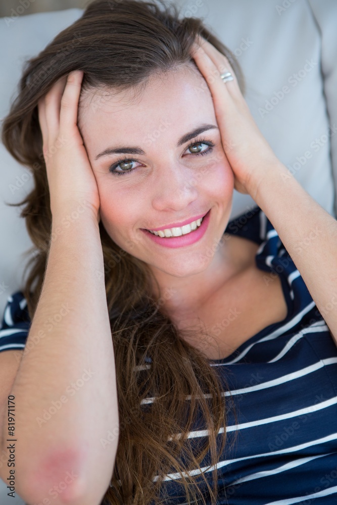 Fototapeta premium Attractive brunette smiling at camera