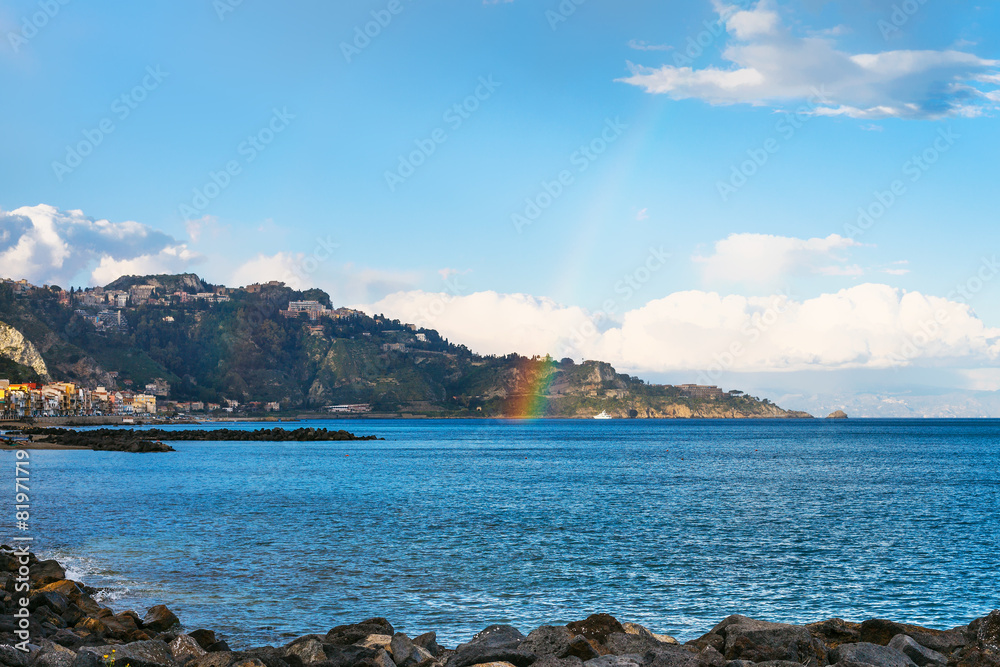view of Giardini Naxos town, cape and rainbow