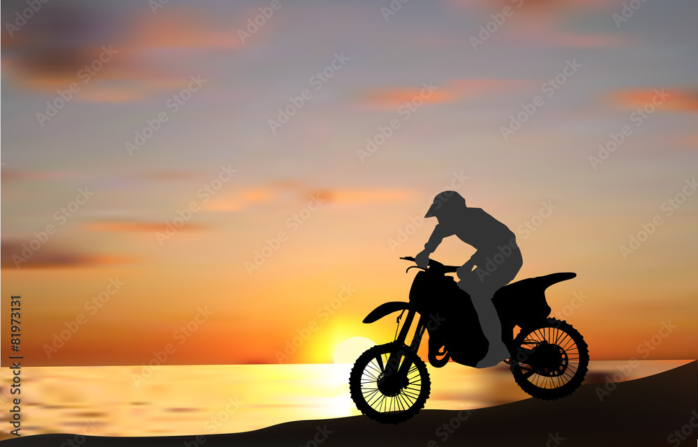 man on motorcycle near sea at sunset man on motorcycle near sea at sunset