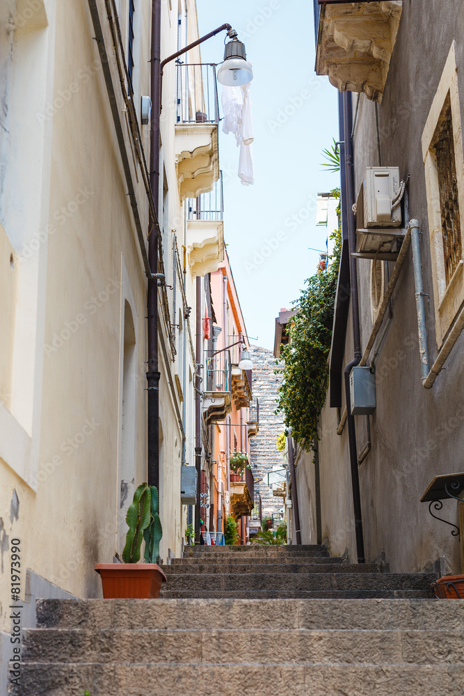 steps on narrow street in Catania city, Sicily