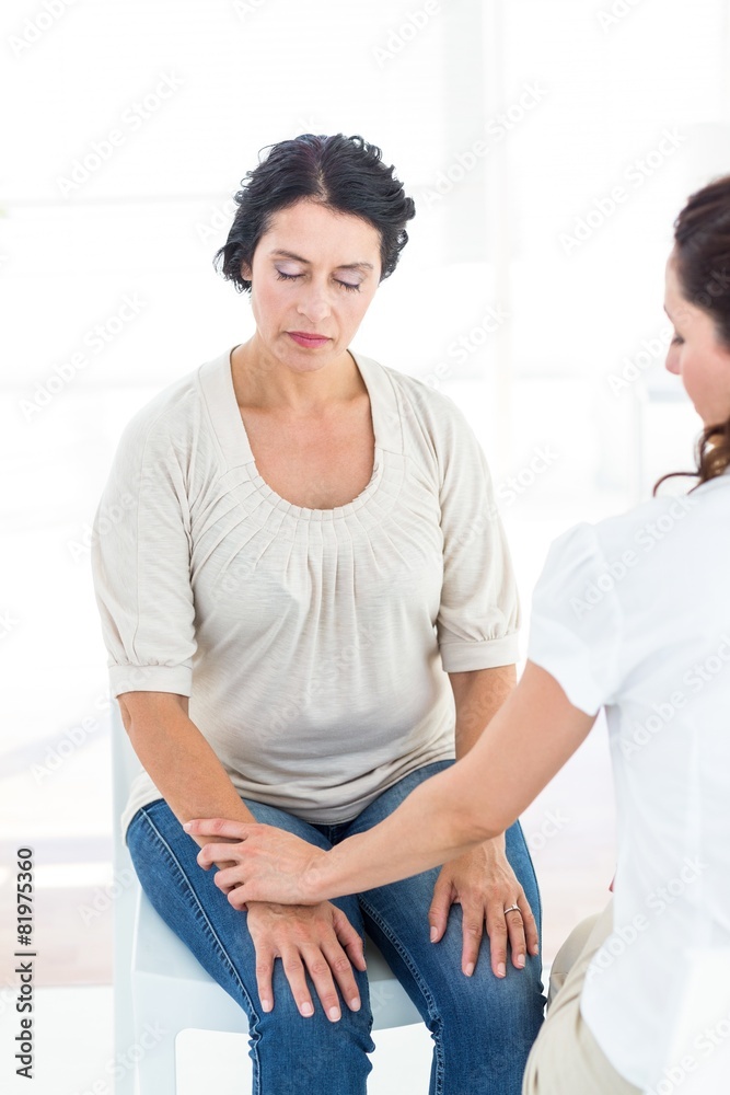 Fototapeta premium Hypnotized woman with her therapist