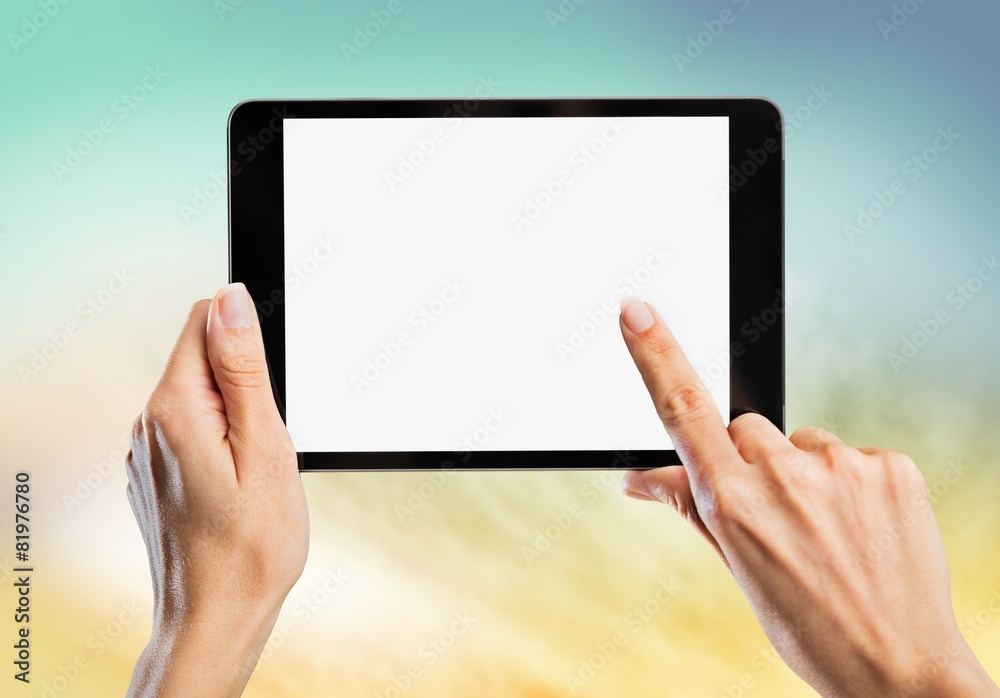 Black. Tablet computer isolated in a hand on the white