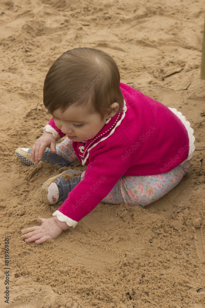 little baby girl playing with sand little baby girl playing with sand