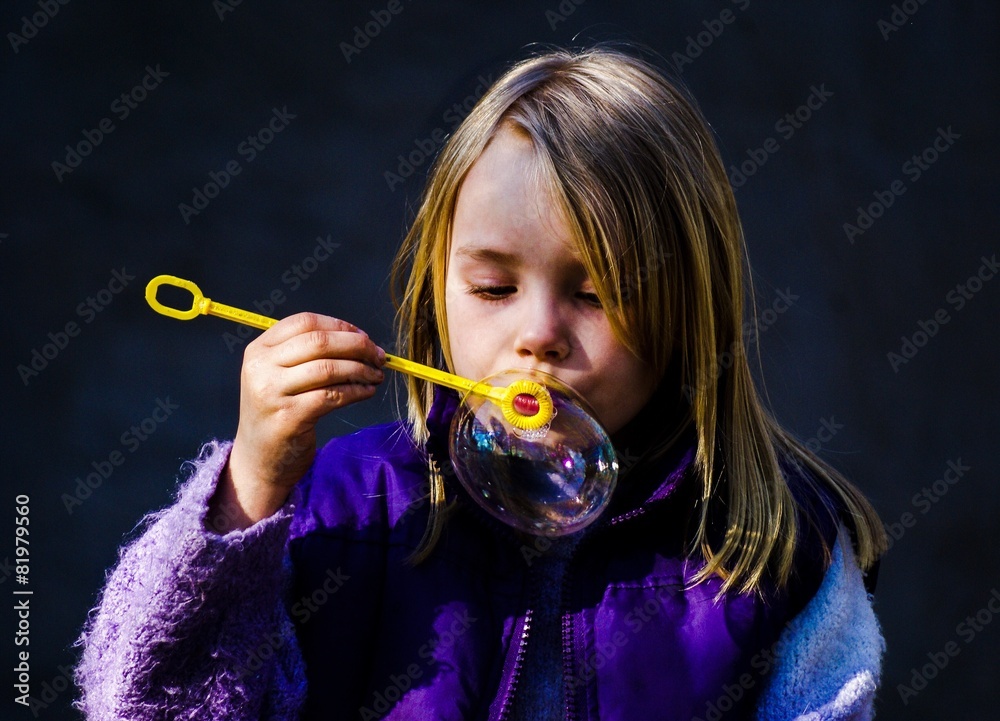 Girl blow soapbubble
