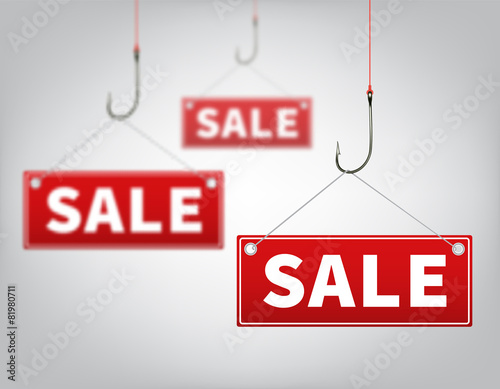 Three red tags of sales, which hangs on a hooks