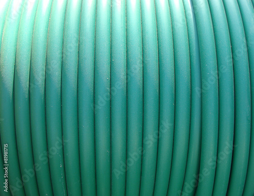 plastic green rolled up hose or cable wire