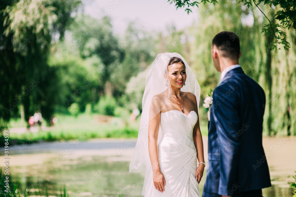 Bride and groom on a romantic moment in their wedding day Bride and groom on a romantic moment in their wedding day