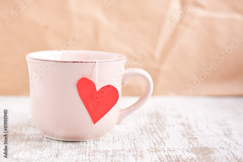 cup with heart shape tea bag