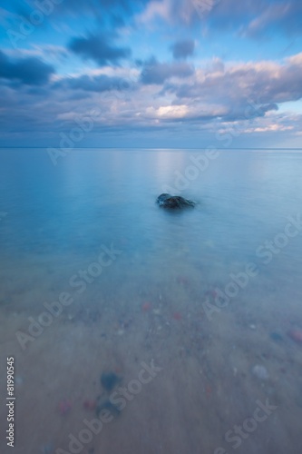 Beautiful long exposure landscape of rocky sea shore