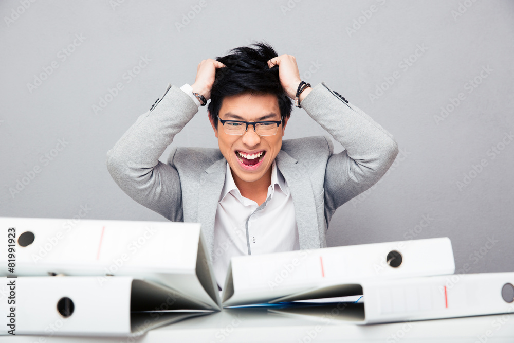 Depressed businessman sitting at the table Depressed businessman sitting at the table