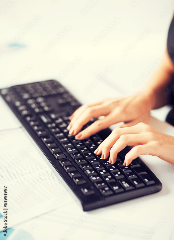 woman hands typing on keyboard woman hands typing on keyboard