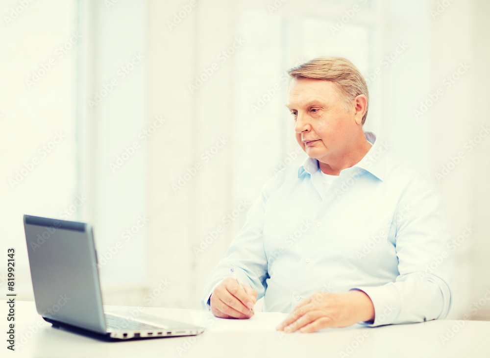 old man filling a form at home old man filling a form at home