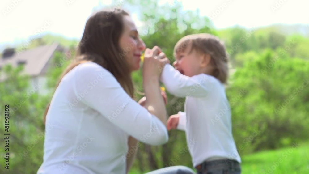 Beautiful family in spring park enjoying nature. Slow-mo 240 fps Beautiful family in spring park enjoying nature. Slow-mo 240 fps