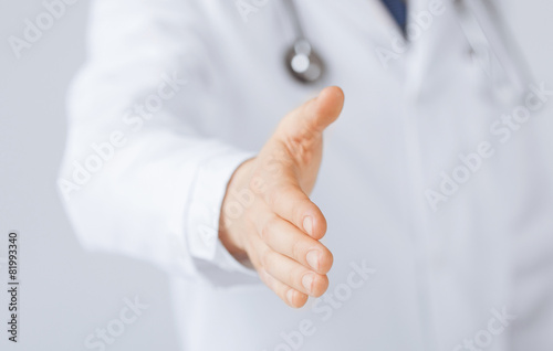 male doctor with open hand ready for hugging