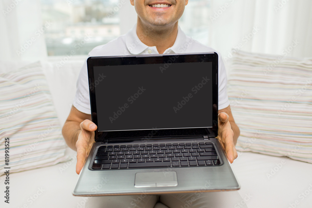 close up of happy man showing laptop at home close up of happy man showing laptop at home