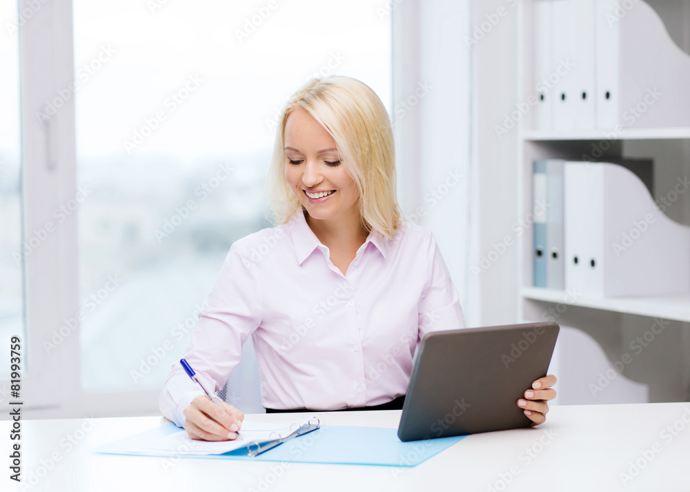 smiling businesswoman or student with tablet pc