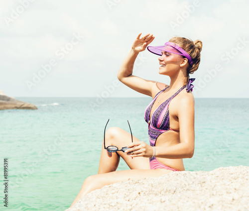 Pretty young fashion sexy woman posing on tropic island