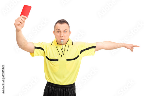 Angry football referee showing a red card photo