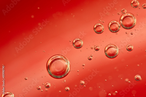 Air bubbles in a red liquid