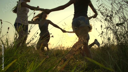 Group of happy teenage friends having fun outdoors photo