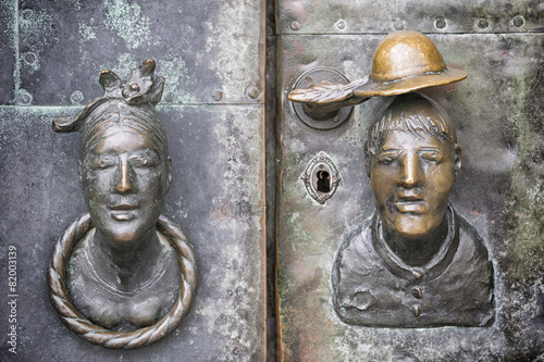 Door with head of woman and man