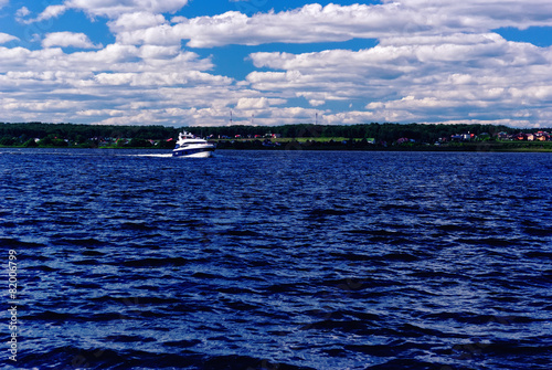 Summer River Bank, Seen from Water, with a Boat Sailing