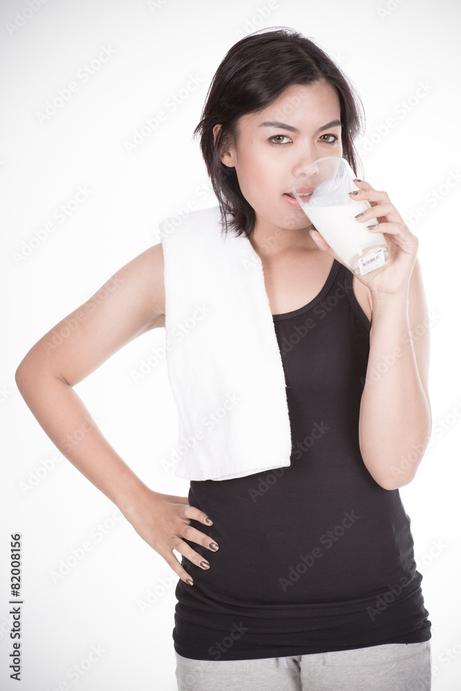 © Nonwarit - Laughing young woman with a glass of milk © Nonwarit - Laughing young woman with a glass of milk