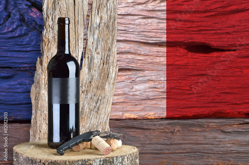 bottle of wine with France flag in the background