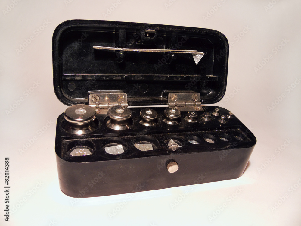 a set of laboratory weights steel tweezers, folded in a box a set of laboratory weights steel tweezers, folded in a box