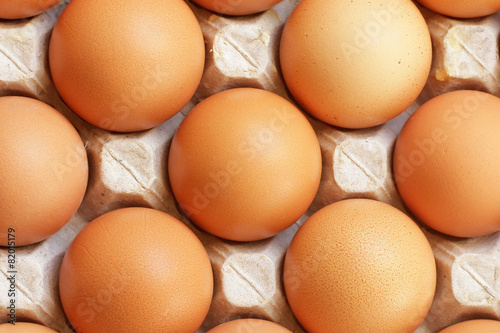 Fresh raw eggs in tray close-up
