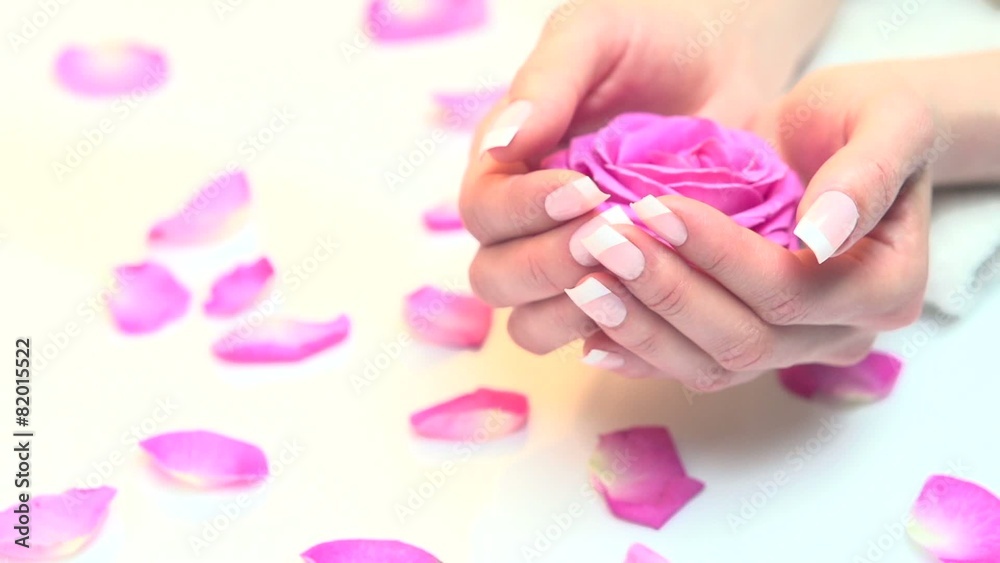Beautiful woman's nails with beautiful french manicure