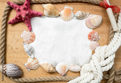 piece of paper with border made from marine knots and seashells