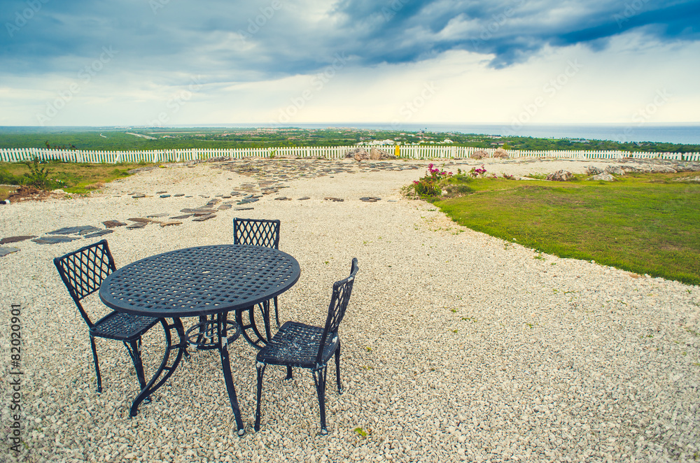 Fototapeta premium Table setting in tropical Outdoor restaurant at the beach. Cafe