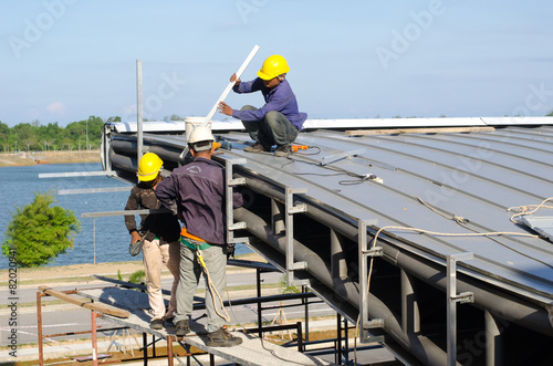 A group of construction worker are working together photo