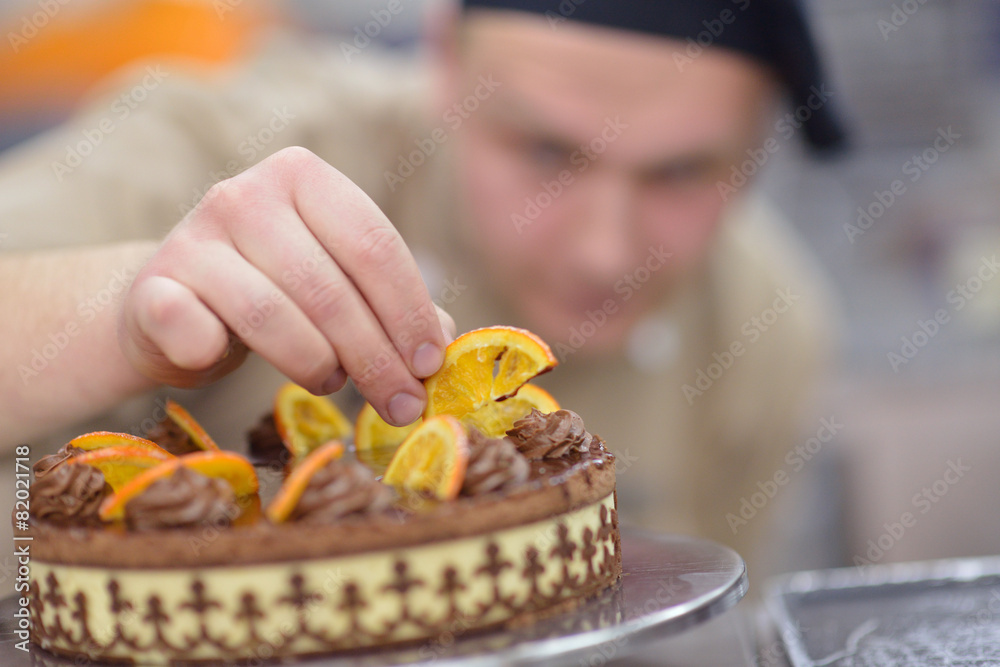 chef preparing desert cake in the kitchen