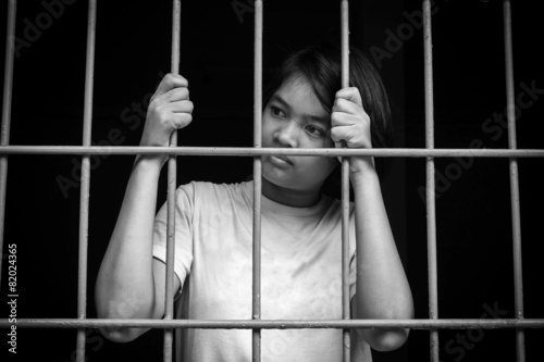 asian girl Hand in jail,black and white tone