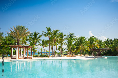 Fototapeta Outdoor Swimming pool of luxury hotel resort near the sea
