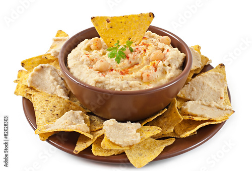Healthy homemade hummus with olive oil and pita chips isolated 