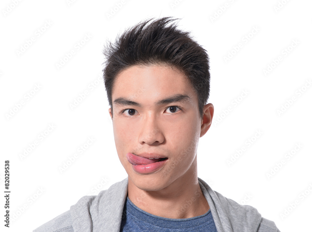 young man showing tongue, face expression young man showing tongue, face expression