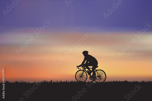 Mountain bike rider in wild meadow nature landscape