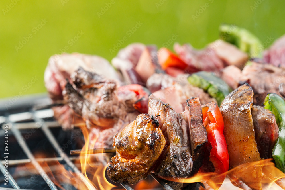 Delicious vegetable and meat skewer on grill