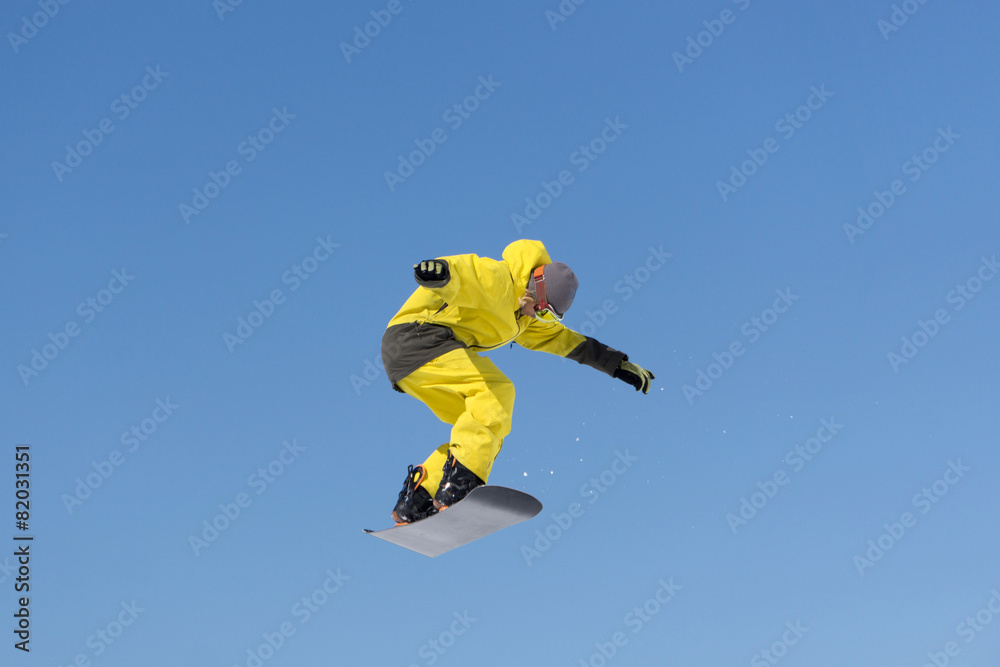 Snowboarder jumps in Snow Park Snowboarder jumps in Snow Park