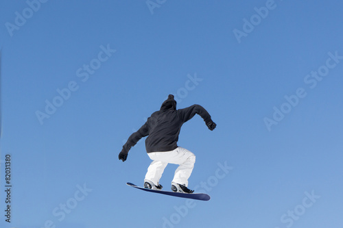 Snowboarder jumps in Snow Park © Vasily Merkushev