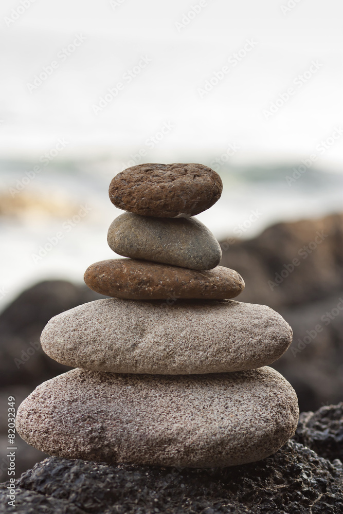 Stones pyramid on sand symbolizing zen, harmony, balance. Stones pyramid on sand symbolizing zen, harmony, balance.