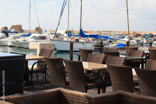 The cozy cafe in the Mediterranean port. Horizontal 