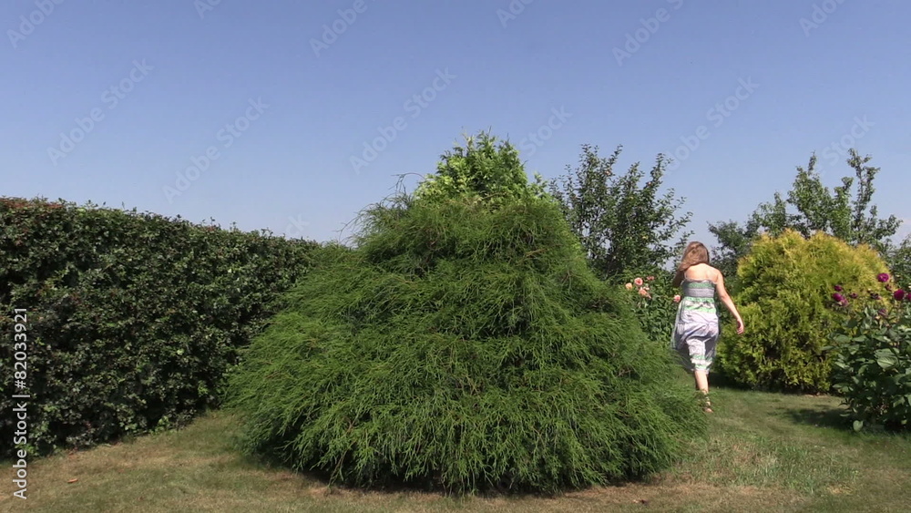 pregnant woman walk barefoot in green park on windy summer day pregnant woman walk barefoot in green park on windy summer day
