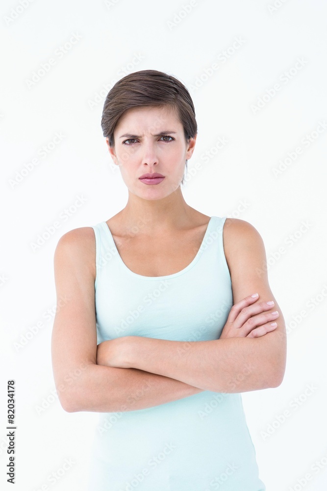 Angry woman looking at camera with arms crossed Angry woman looking at camera with arms crossed