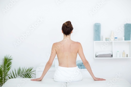 Woman sitting on massage table © WavebreakMediaMicro