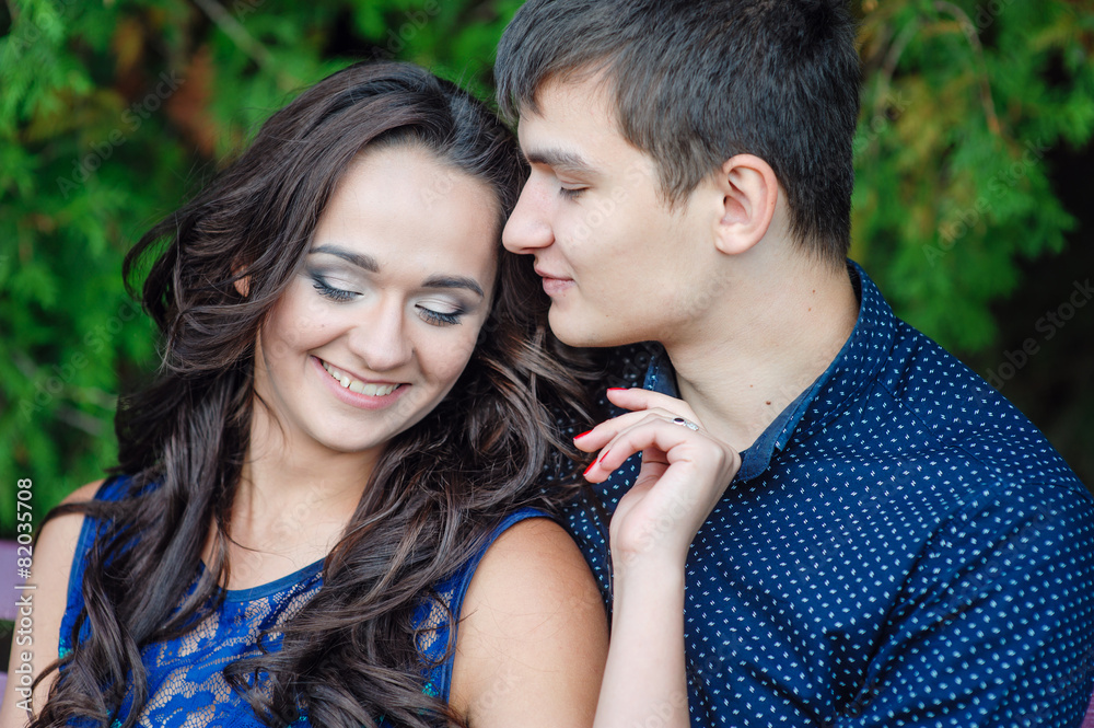Romantic couple in love walking in the summer park Romantic couple in love walking in the summer park